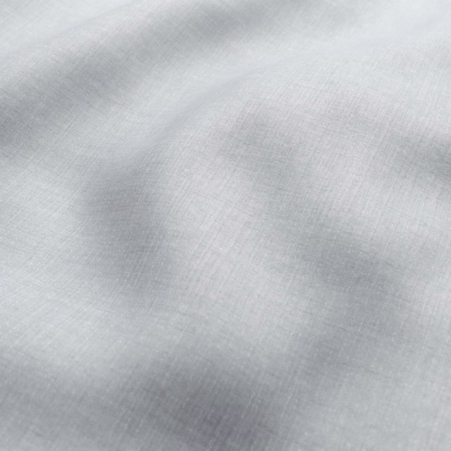 Pale pigeon-grey fabric with a fine crosshatched weave and softly clouded shading