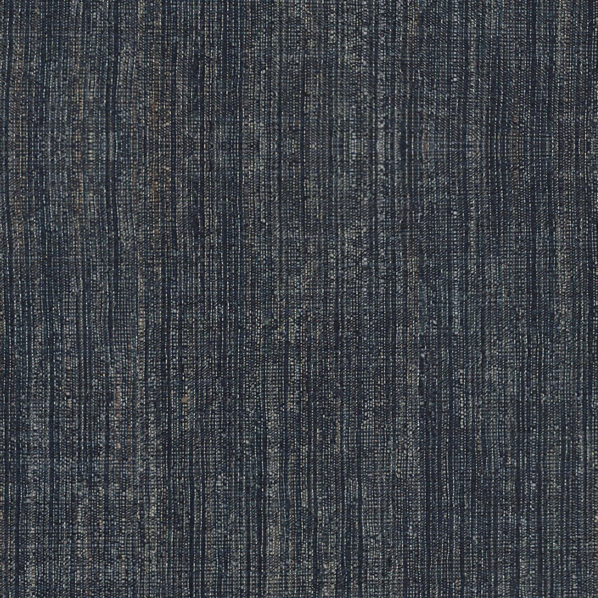 Deep charcoal-grey woven swatch with irregular pale vertical slubs and subtle blue flecks