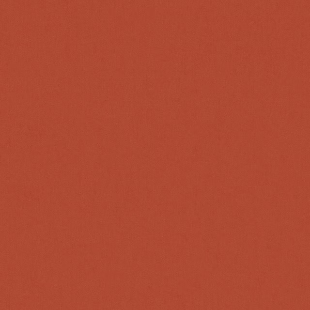 Close-up of warm redwood terracotta fabric with a subtle, even grain
