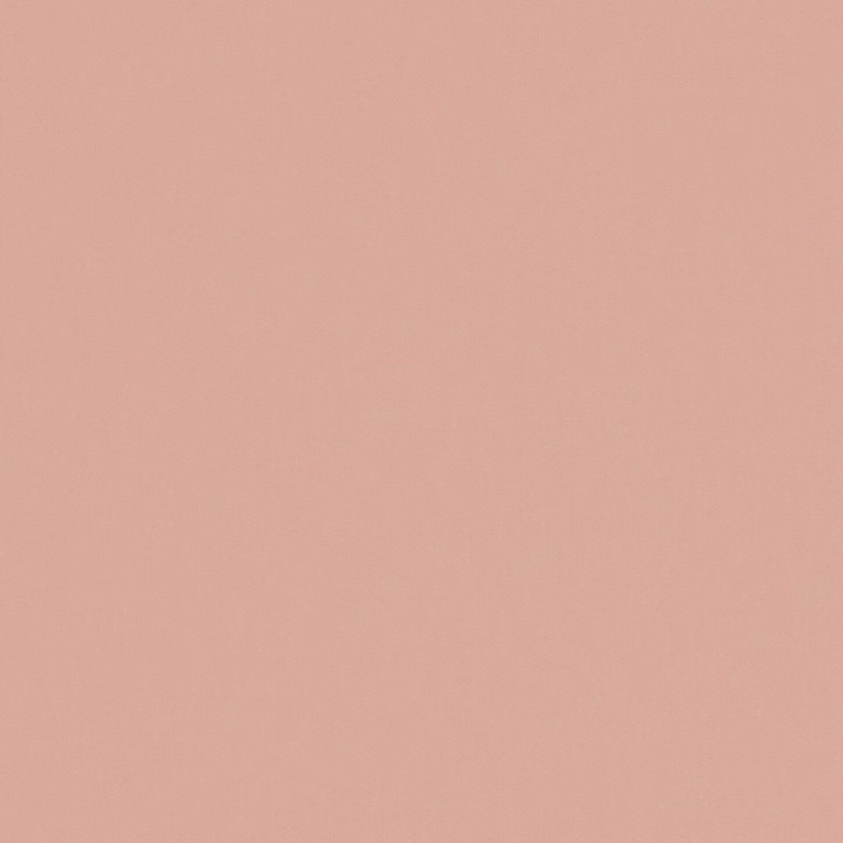 Close-up of muted dusty pink fabric with a fine, even textile grain