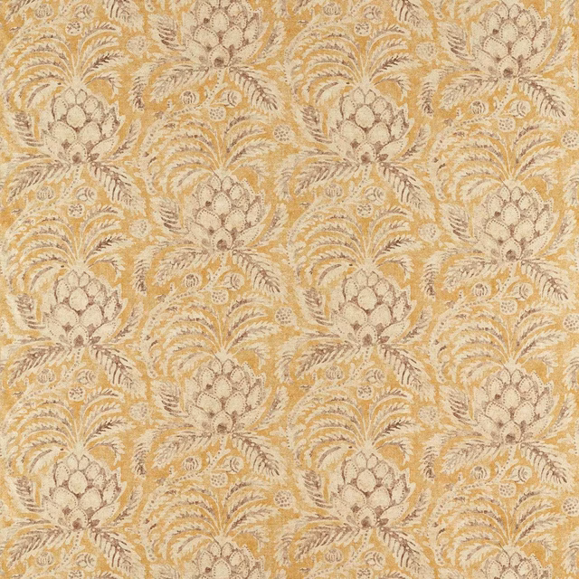 Warm ochre woven fabric with pale pineapple motifs and curling botanical foliage