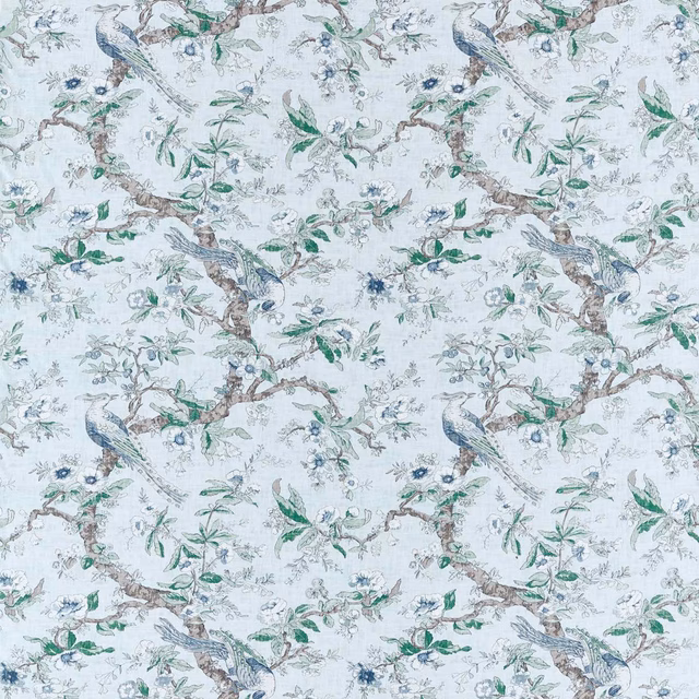 Pale blue-stone fabric with branching foliage, perched birds and muted green botanical details