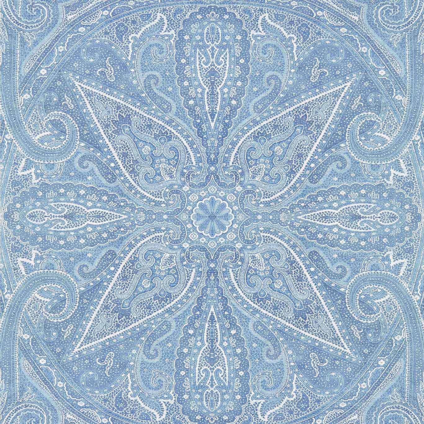 Pale indigo-blue wallpaper with white paisley scrolls and central floral medallion