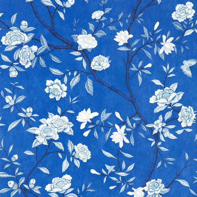Cobalt-blue wallpaper with white flowering branches and pale blue leaves
