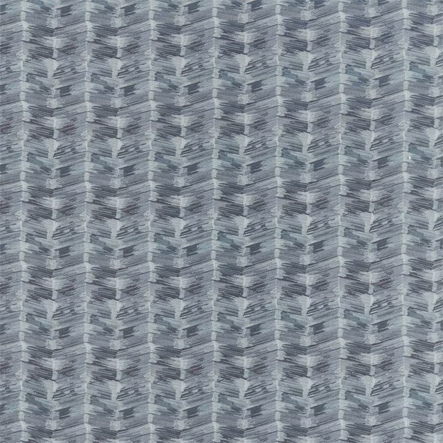 Close-up of cool blue-grey woven fabric with layered vertical chevron motifs