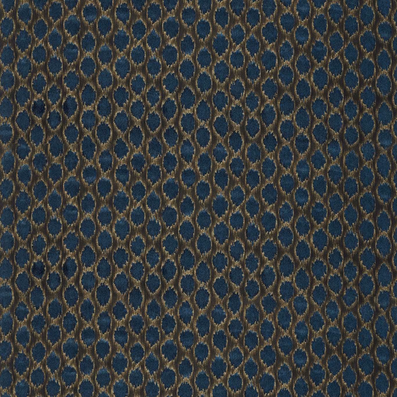 Deep ink-blue velvet with bronze oval ikat spots and a plush pile