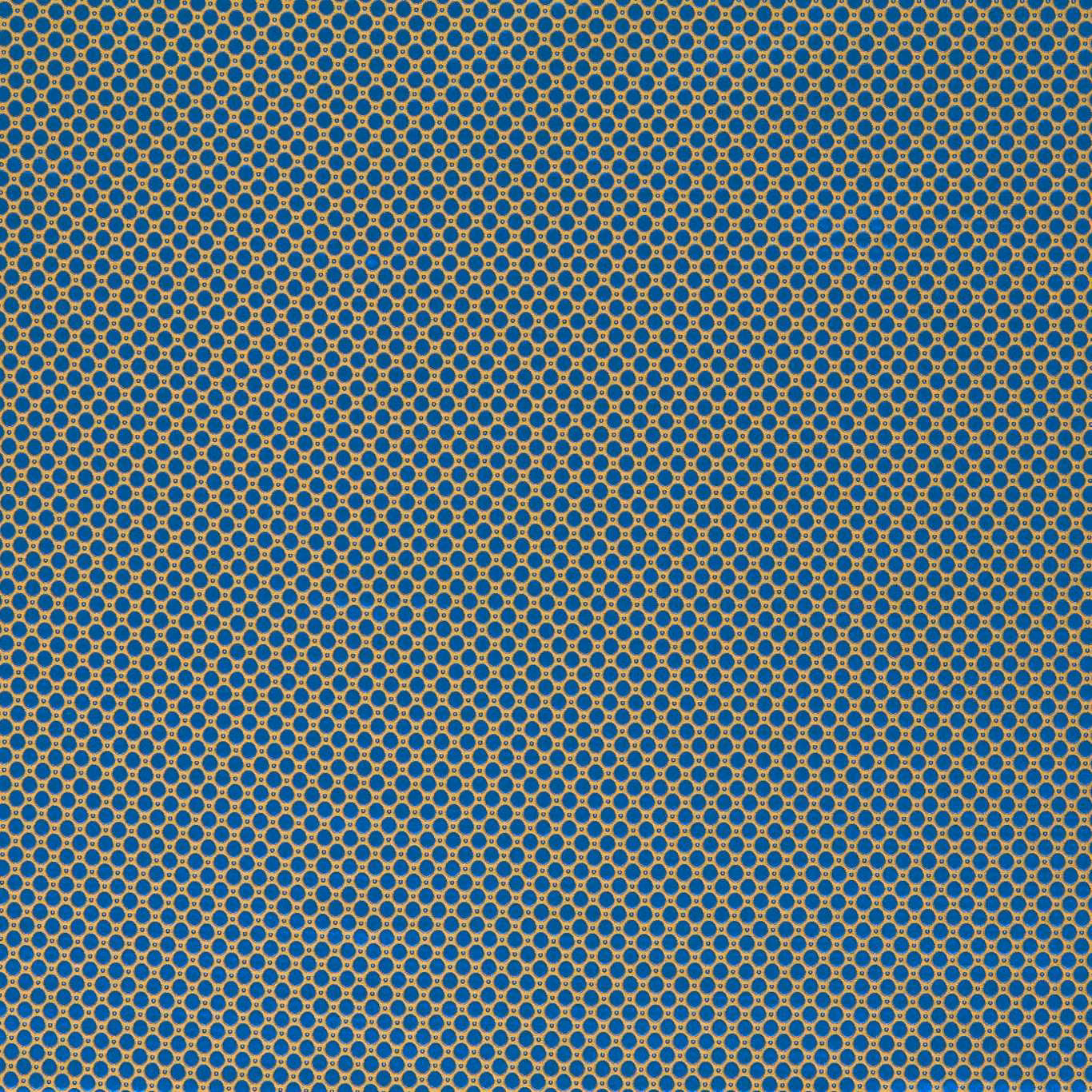 Deep lazuli blue woven fabric with tiny ochre ring spots in a close grid