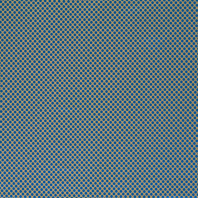 Deep lazuli blue woven fabric with tiny ochre ring spots in a close grid
