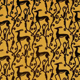 Ochre-gold fabric with black deer, curling vines and a dense botanical repeat