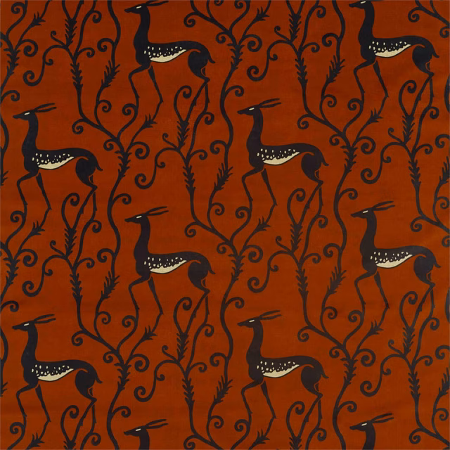 Rust terracotta velvet with black deer, cream spots and scrolling botanical motifs