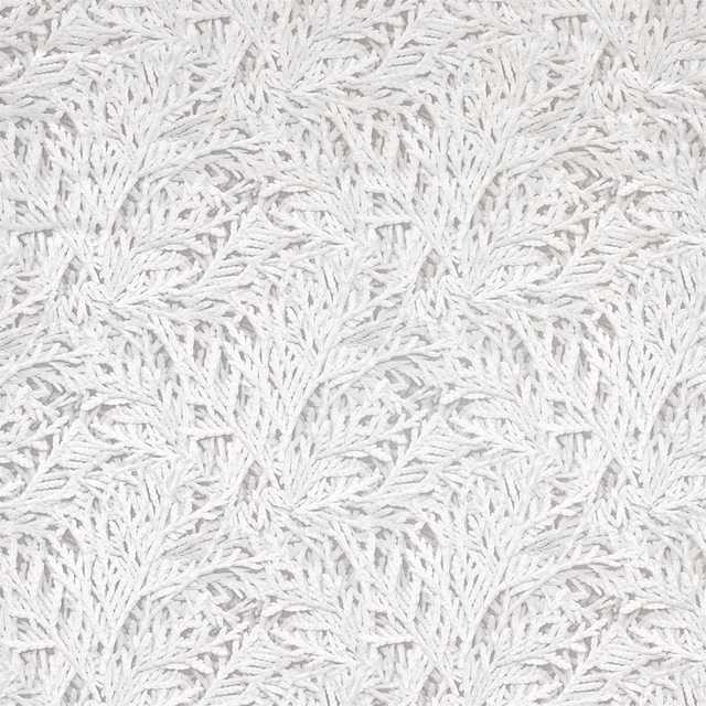 Pale silver-grey fabric with dense raised white leafy botanical motifs
