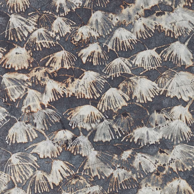 Blue-stone textile with chalky fan-shaped botanical motifs and distressed grey detail