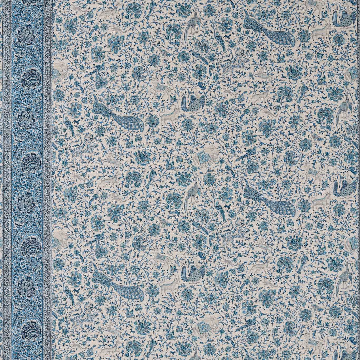 Mazarine blue peacocks and curling foliage on an ivory wallpaper ground