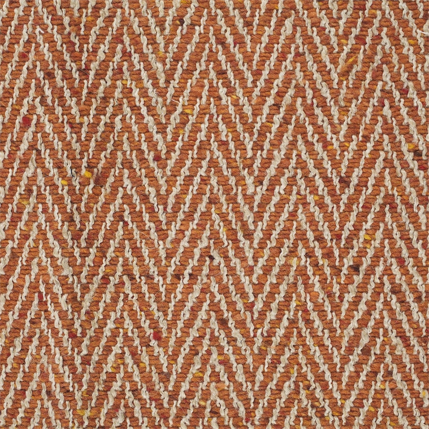 Burnt orange woven upholstery with raised ivory zigzags and subtle golden flecks