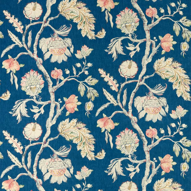 Deep blue floral fabric with cream branches, blush blossoms and pale yellow leaves