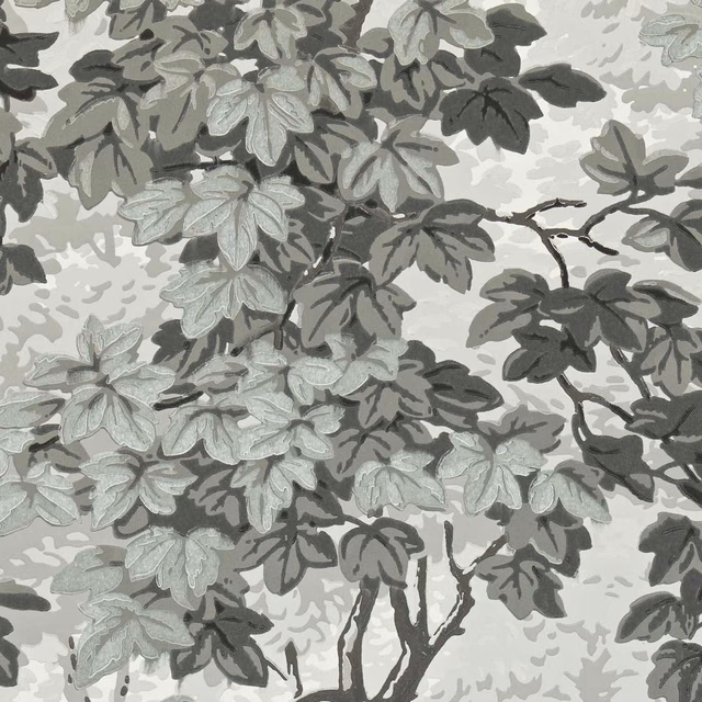 Dense charcoal and silver-grey leafy branches on a pale grey wallpaper ground