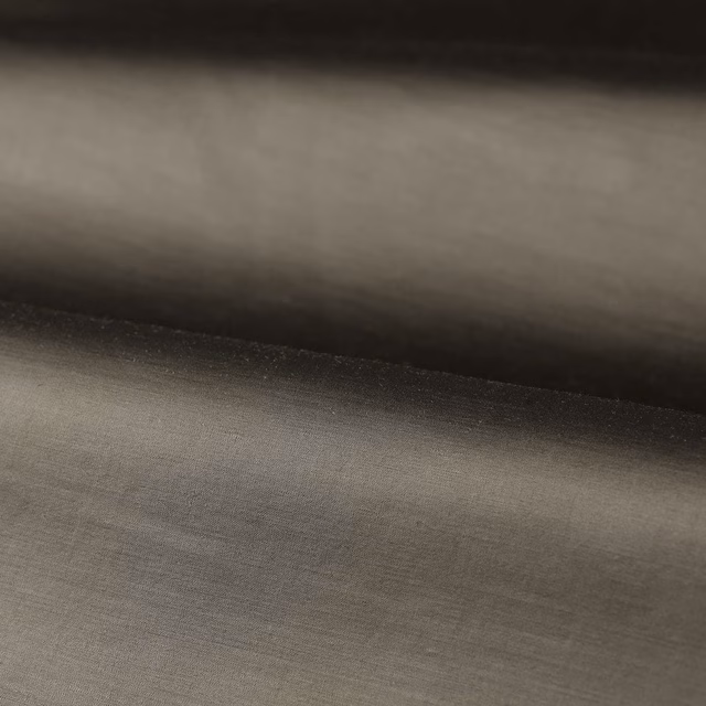 Deep anthracite plain weave with a soft grey sheen across folded cloth