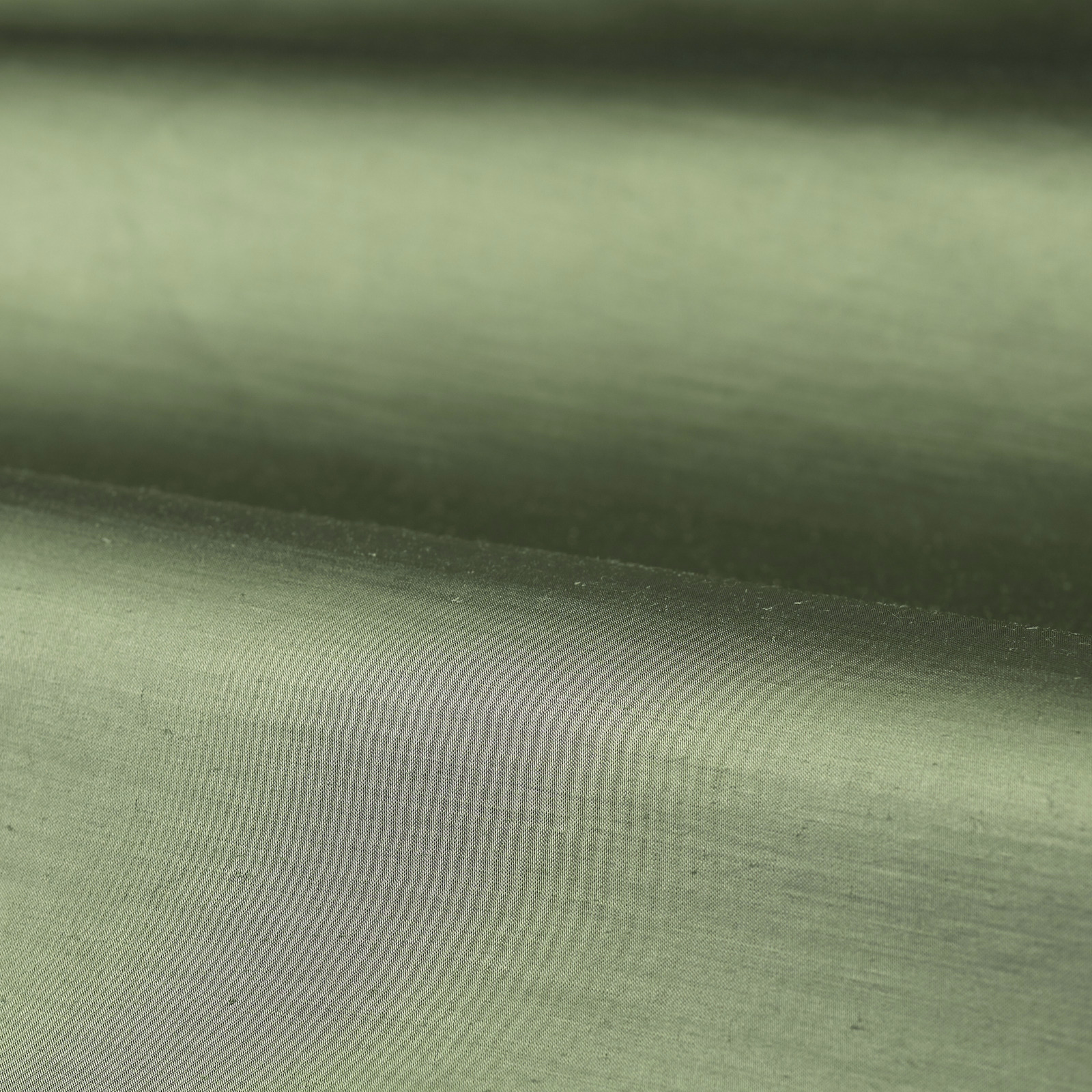 Muted jade-green plain weave showing fine horizontal texture and soft tonal shading