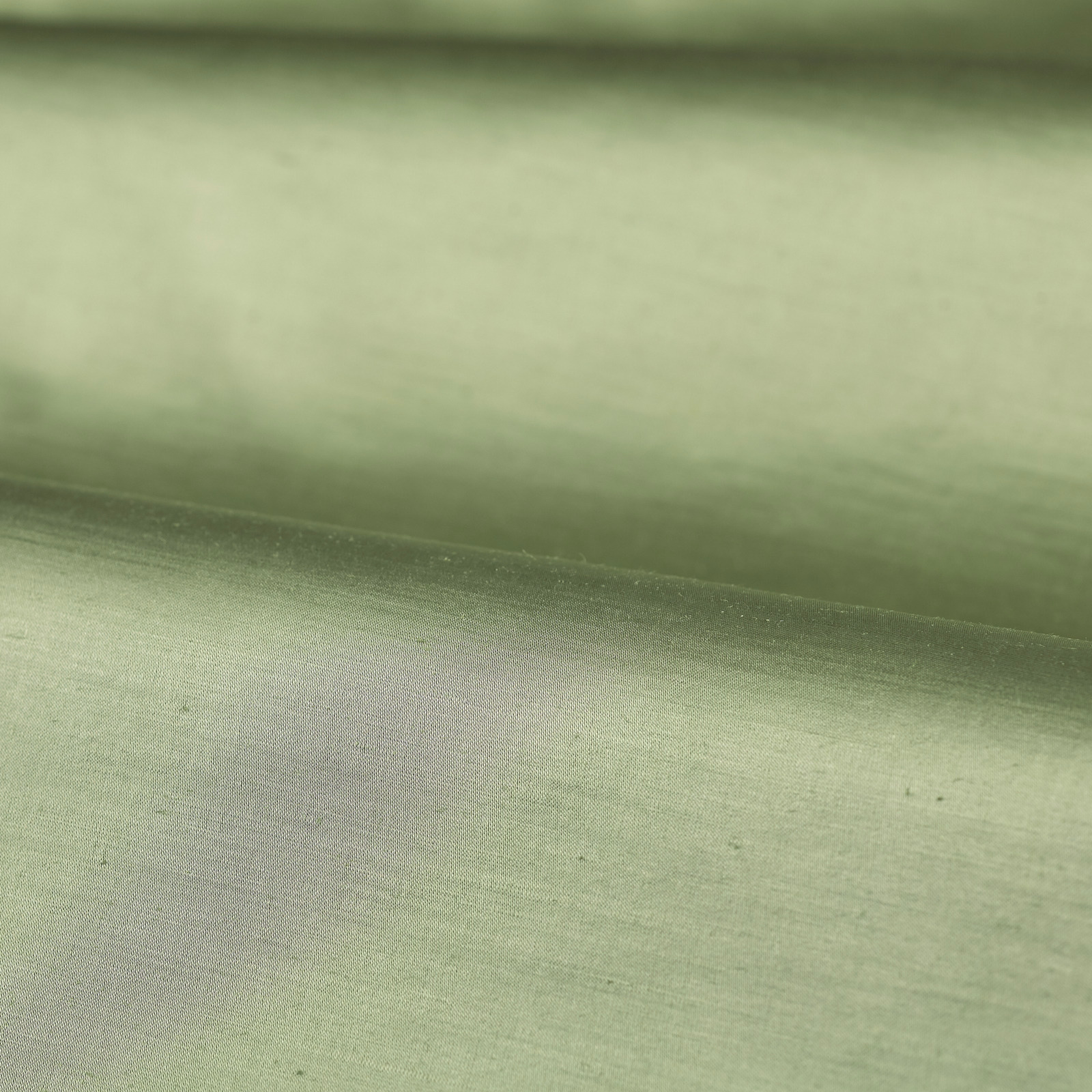 Pale olive plain fabric with fine horizontal weave and soft folded sheen