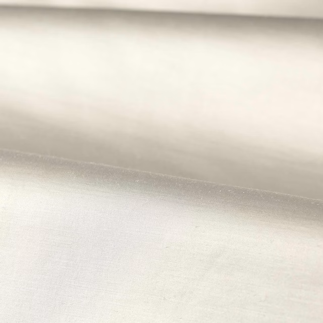 Folded platinum-white plain weave showing a fine, softly silvery surface