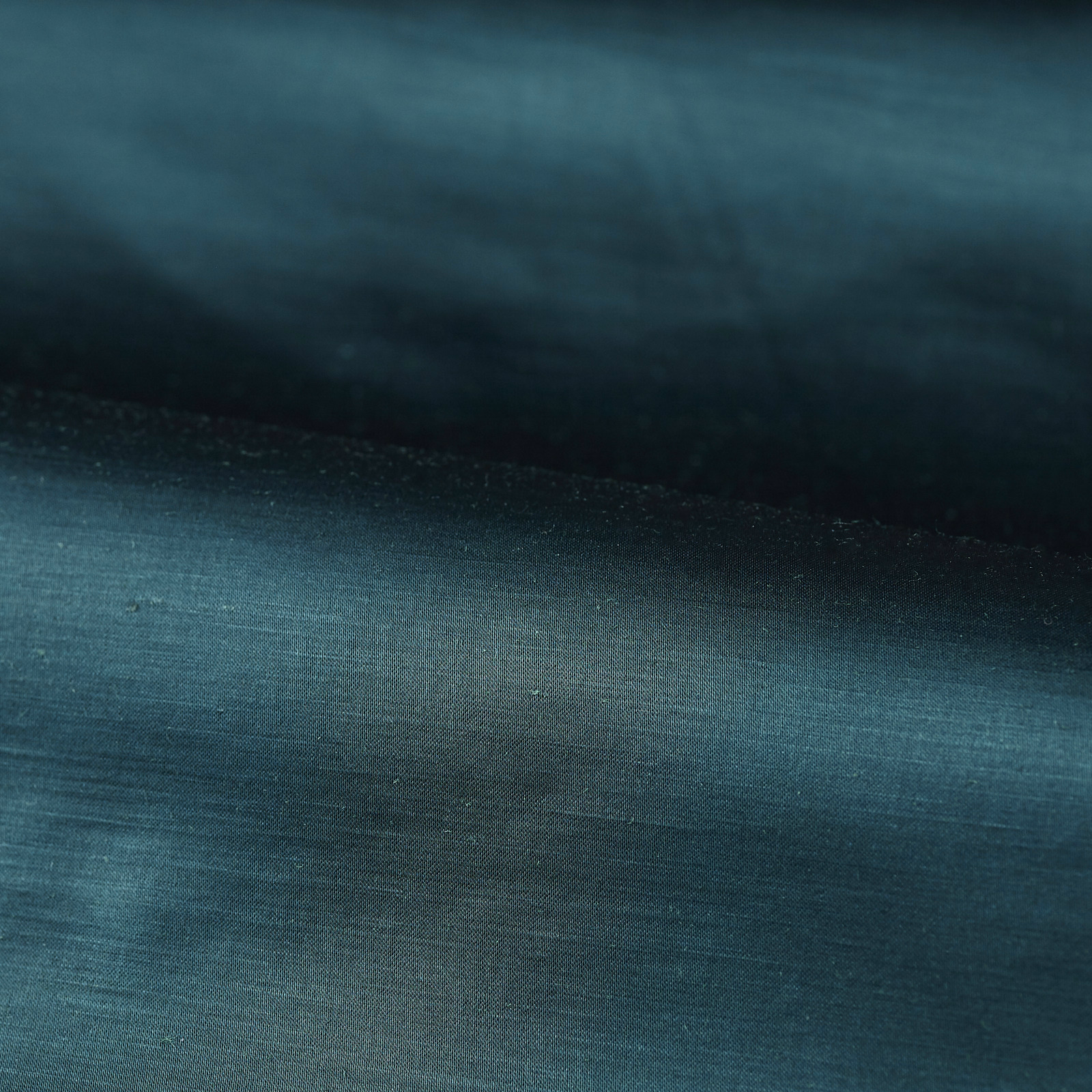 Deep Prussian blue plain weave with teal highlights and near-navy shaded folds