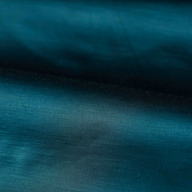 Deep Prussian blue plain weave with teal highlights and near-navy shaded folds