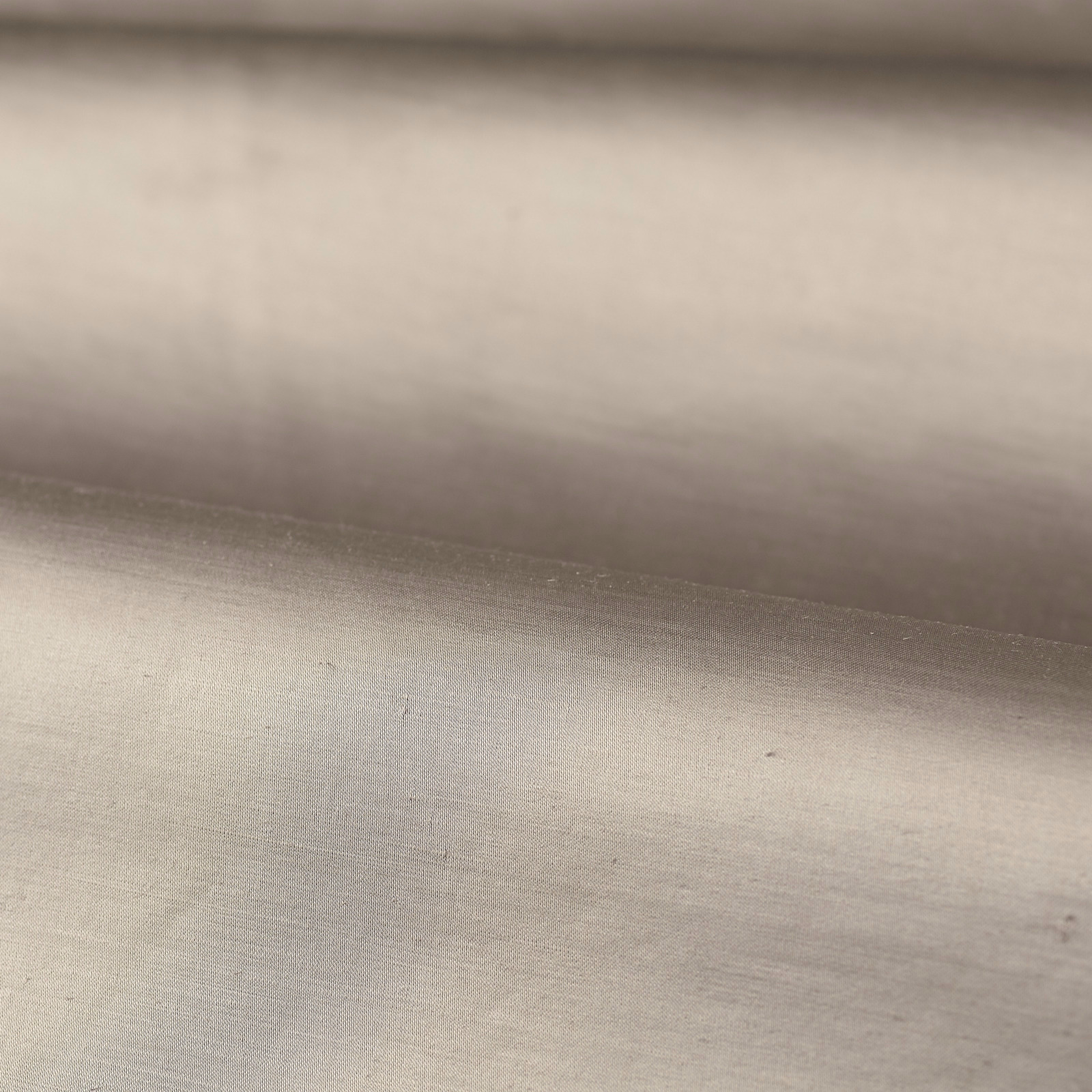 Close-up of pale dusty rose plain weave with soft grey shading and subtle sheen