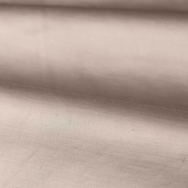 Close-up of pale dusty rose plain weave with soft grey shading and subtle sheen