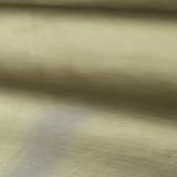Close-up of softly lustrous muted sage-green plain fabric with fine horizontal weave