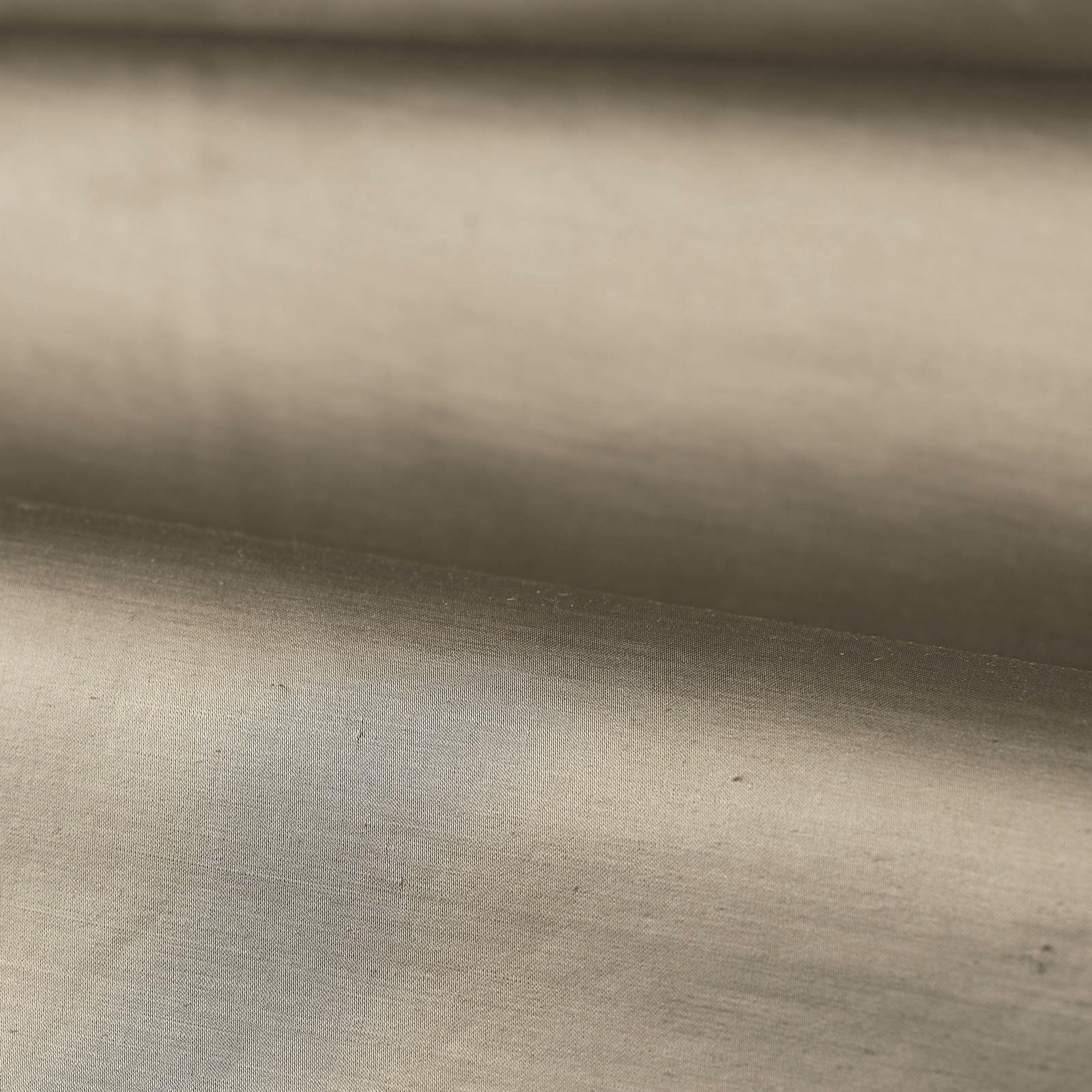 Warm stone-taupe plain woven fabric showing subtle horizontal tonal shading