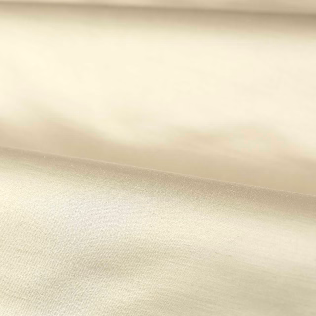 Warm white-clay plain weave with fine horizontal texture and soft diffused sheen