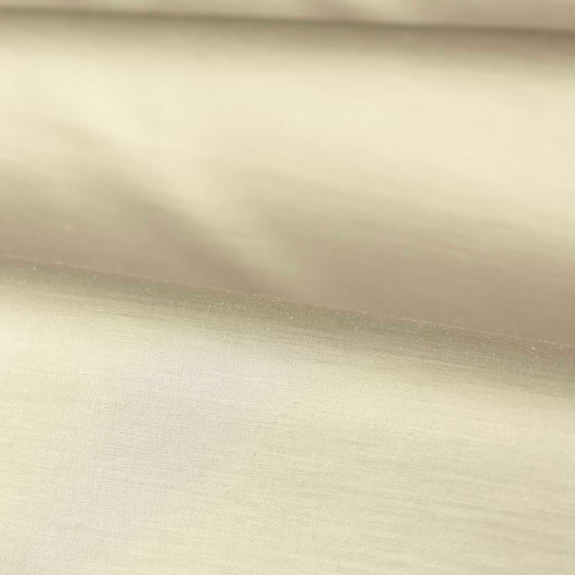 Soft ivory opal plain weave fabric with a gentle horizontal sheen