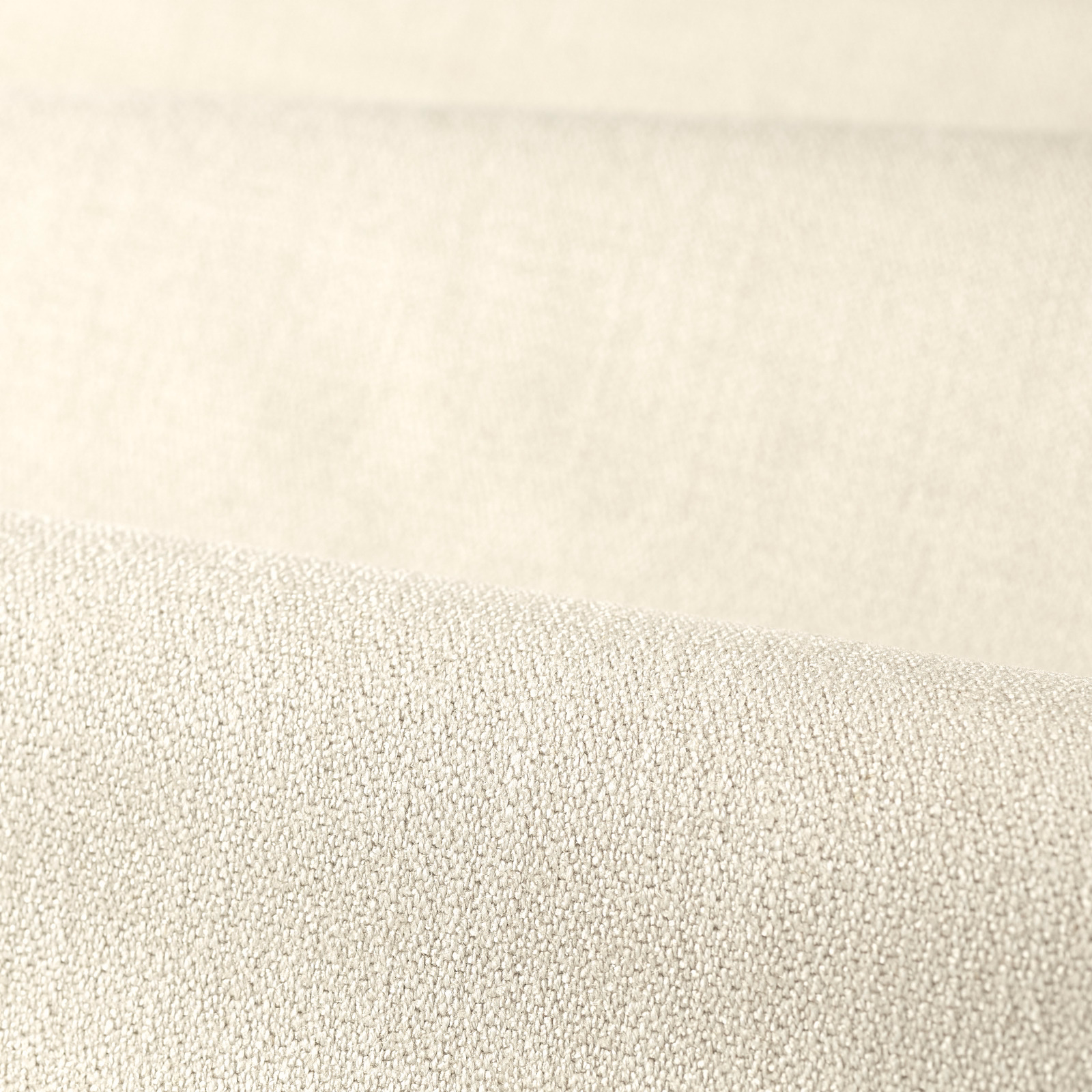 Pale chalk cream plain weave showing a fine pebbled texture in close-up
