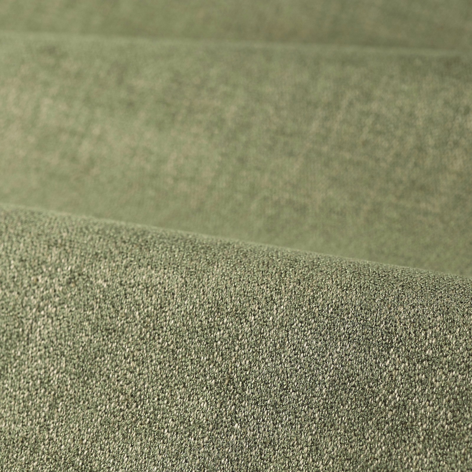 Muted sage-green stone fabric with dense finely pebbled woven texture