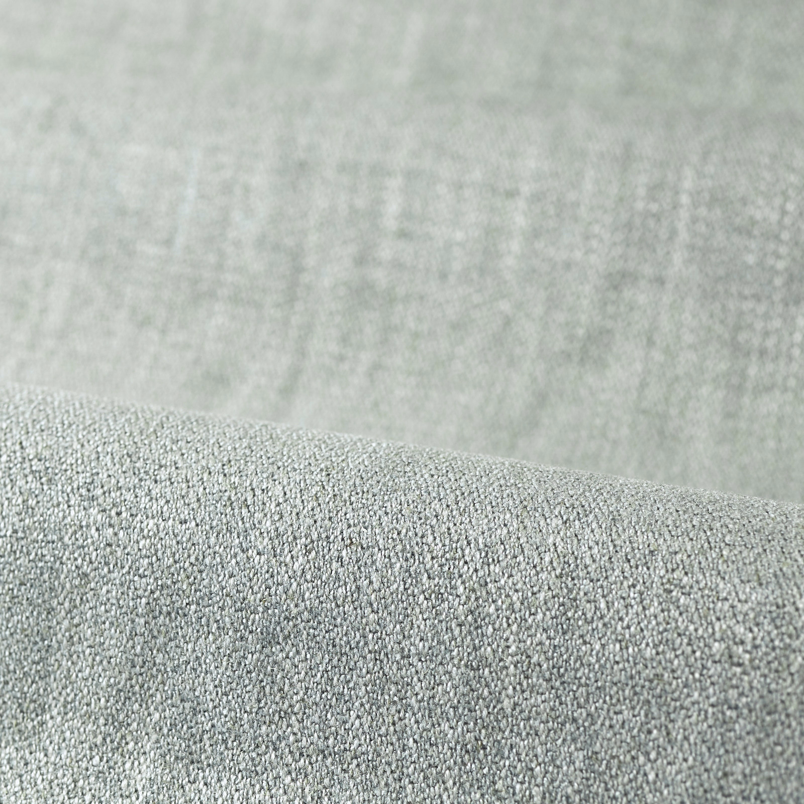 Pale sage grey-green plain upholstery fabric with a dense pebbled weave