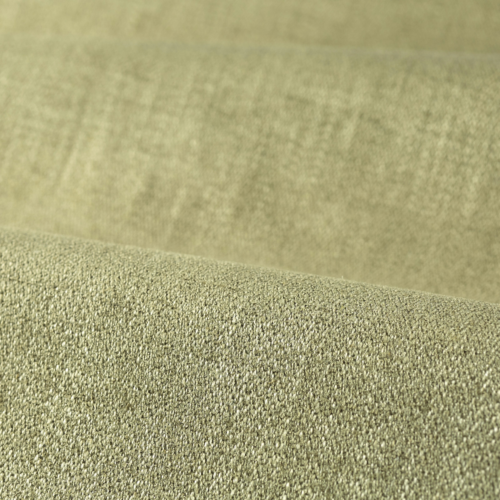 Close-up of muted sage green fabric with a dense, subtly pebbled weave