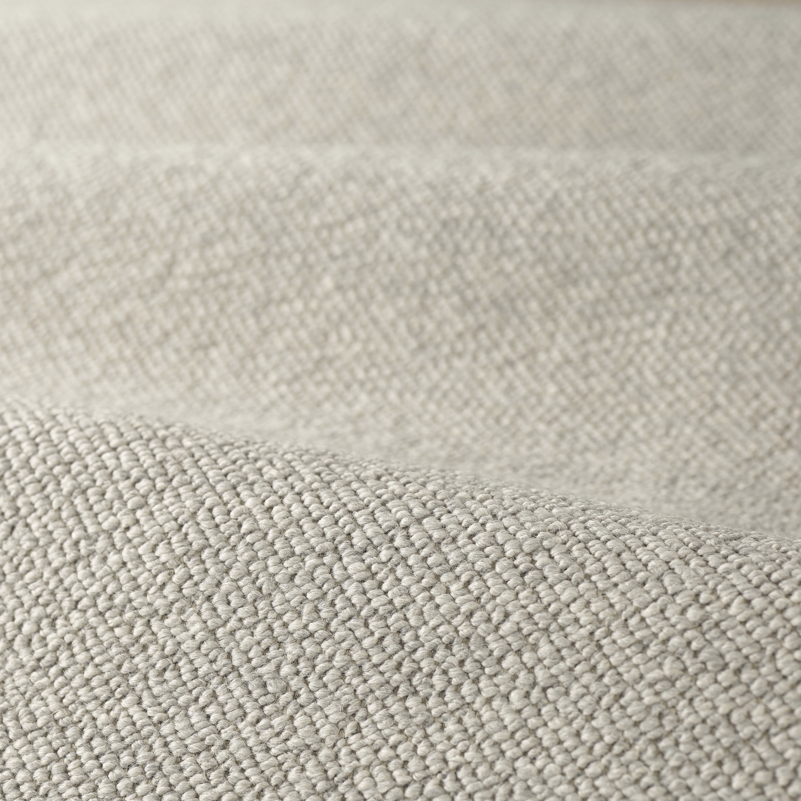 Pale warm-grey boucle with dense rounded loops and a softly mottled surface
