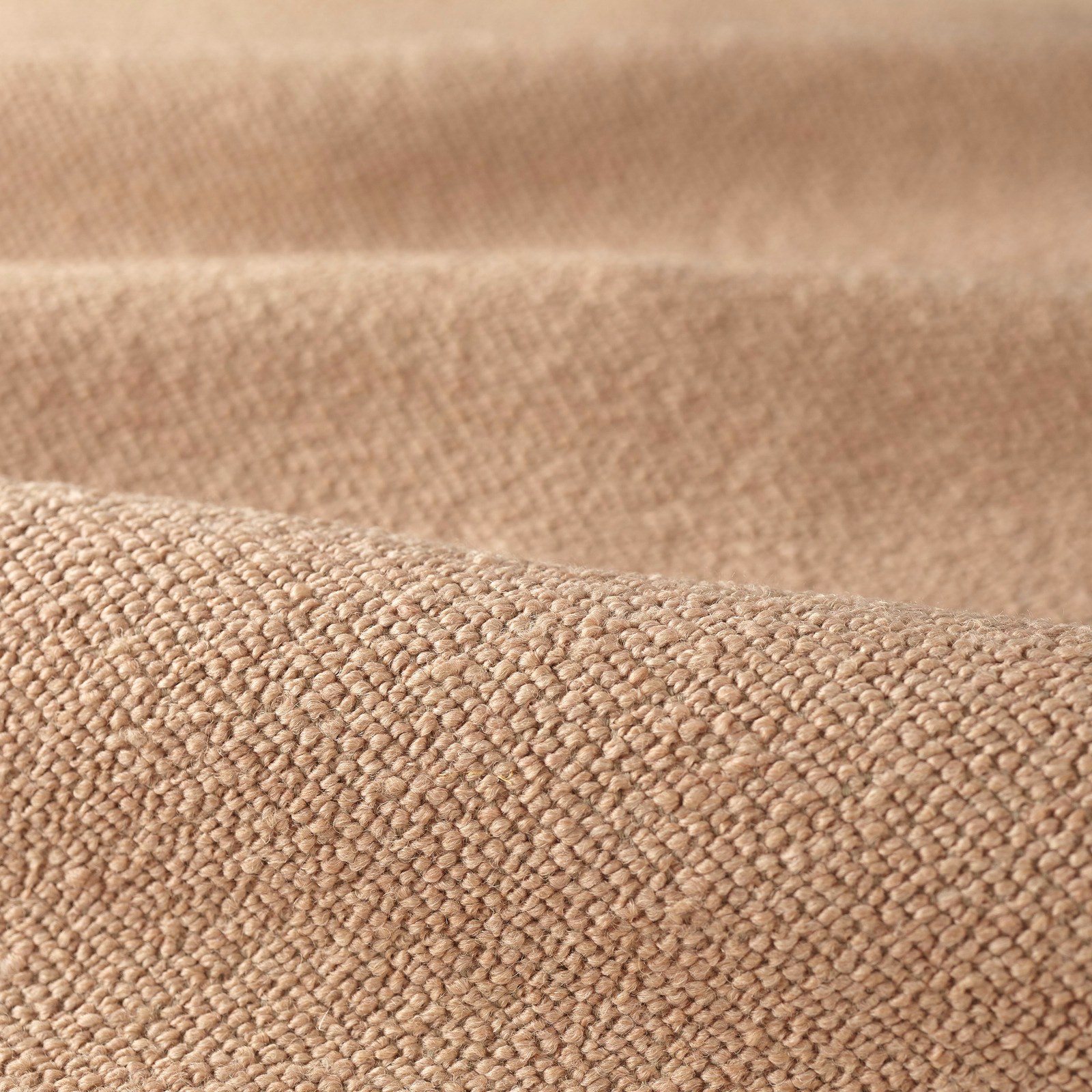 Warm blush-pink boucle with a dense, softly pebbled woven surface