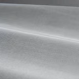 Cool silver-grey velvet showing directional pile and softly light-catching folds