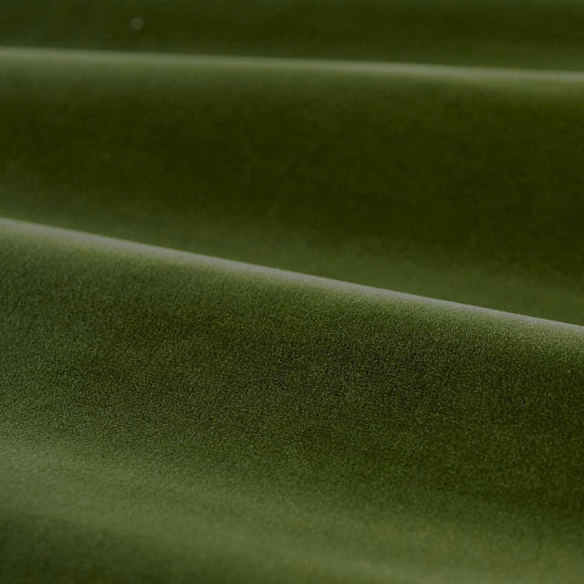 Deep evergreen velvet pile with olive highlights across soft horizontal folds