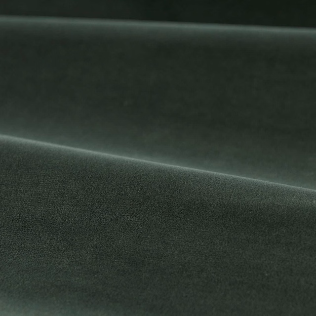 Deep green slate velvet with softly brushed pile catching light across folded cloth