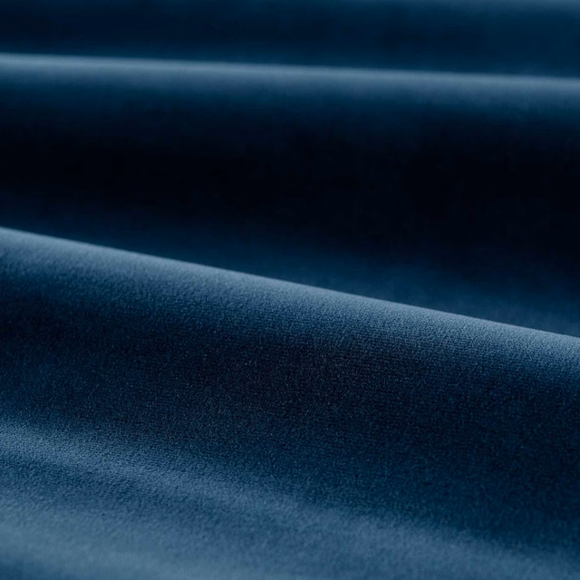 Deep mazarine blue velvet swatch showing a smooth plain pile and soft folded sheen