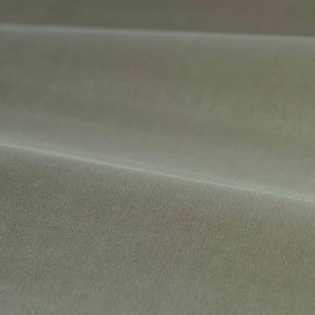 Muted grey-green velvet with soft pile and gentle highlights across folded fabric