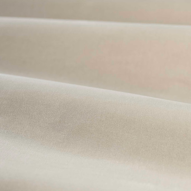 Pale blush velvet with a soft nap and subtle satin-like sheen