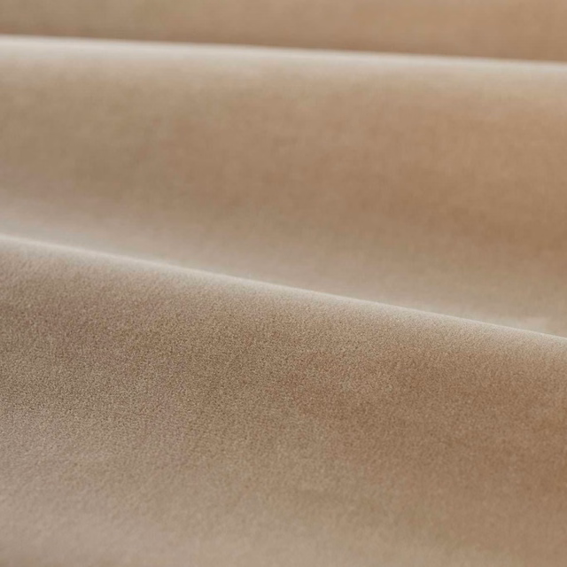Warm parchment beige plain velvet folded to show a soft directional sheen