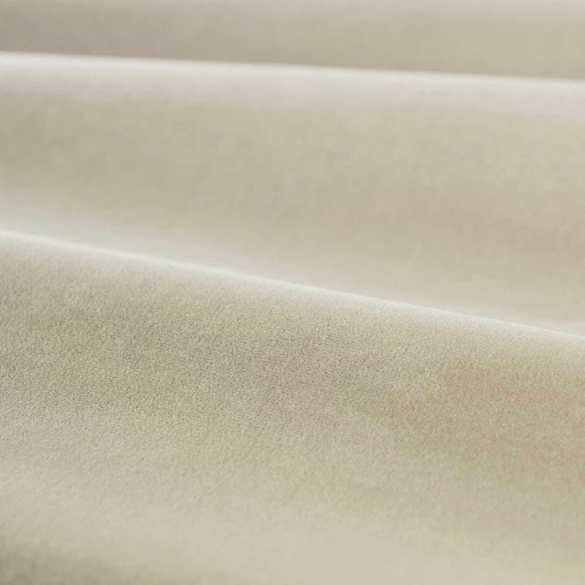Pale platinum grey velvet swatch showing smooth nap, soft folds and creamy highlights
