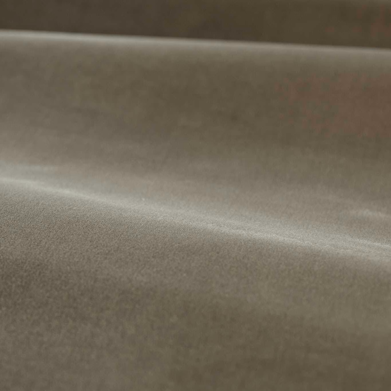 Close view of muted silver-grey plain velvet with a softly luminous nap