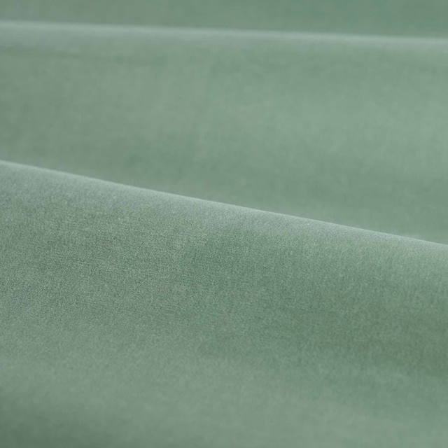 Muted seafoam-blue velvet showing a softly brushed nap across folded swatch