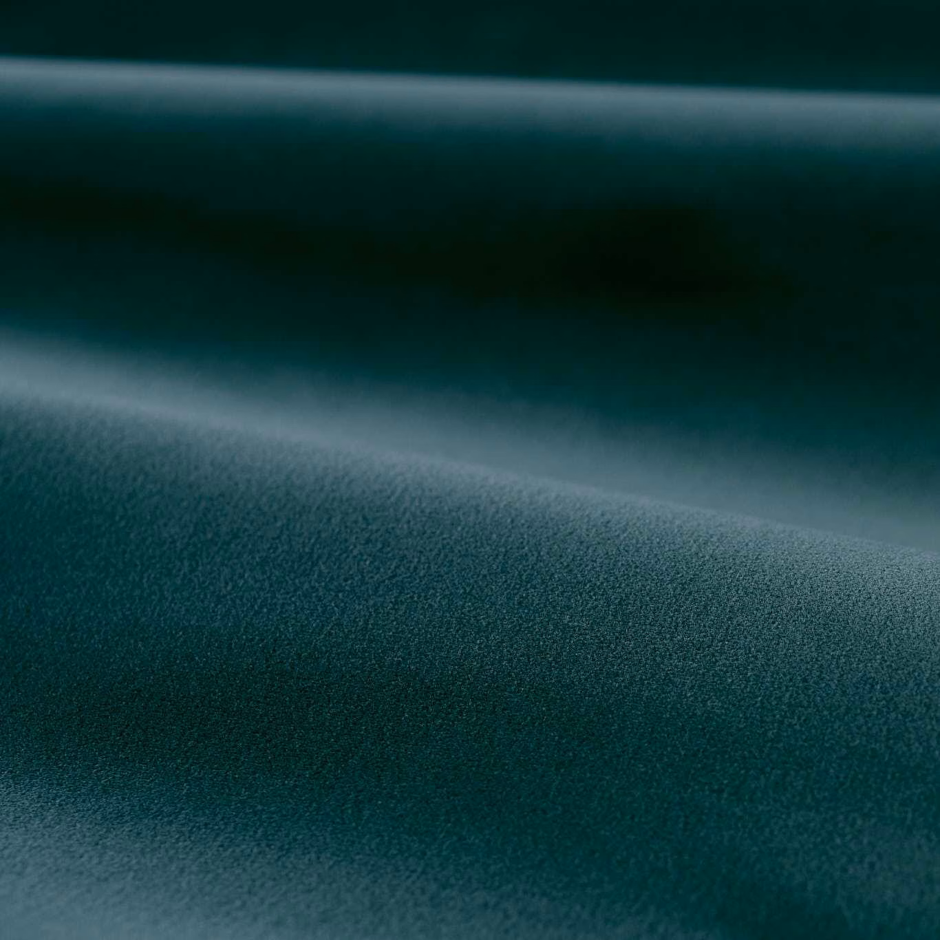 Deep blue teal velvet with directional sheen and a softly brushed pile