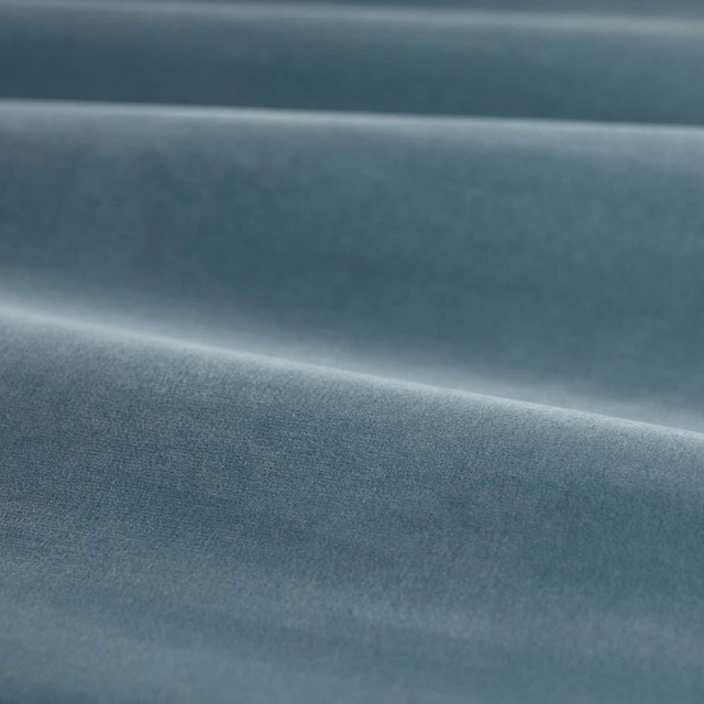 Cool slate blue-grey velvet with soft directional sheen across folded ridges